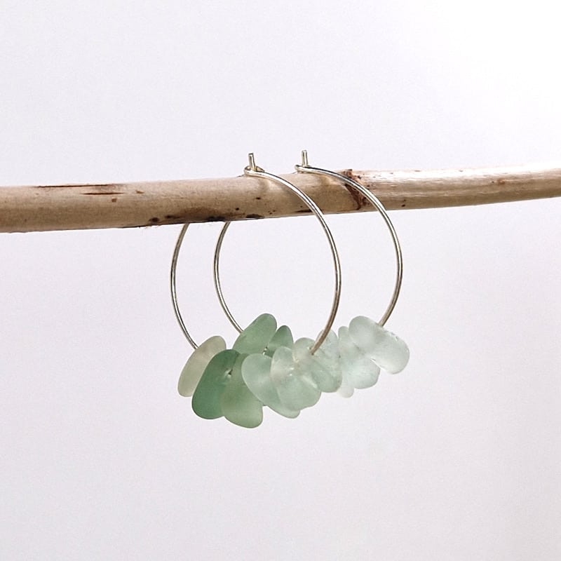 Lush Sea Glass Hoops hanging on wooden stick