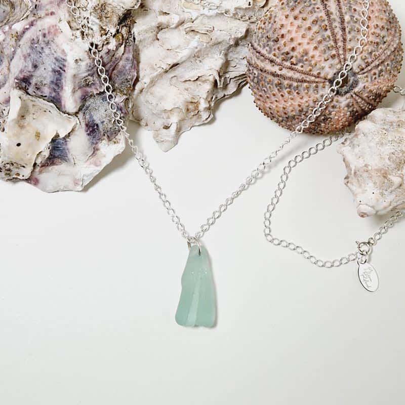 Sea glass necklace presented with sea shells