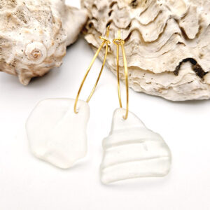 Andrina Golden Hoops, sea glass strung on golden hoops laying in front of sea shells