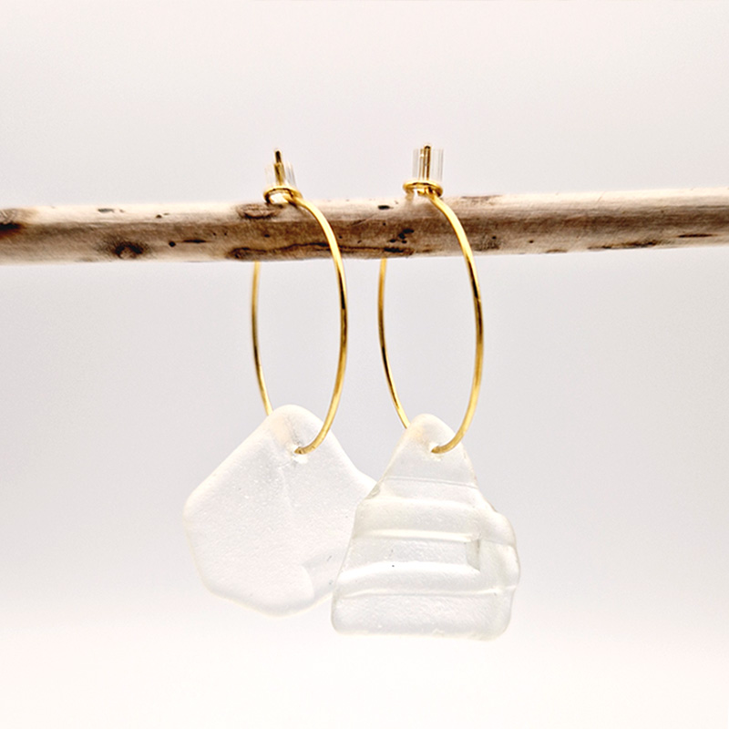 Andrina Golden Hoops, sea glass strung on golden hoops hanging on a wooden stick